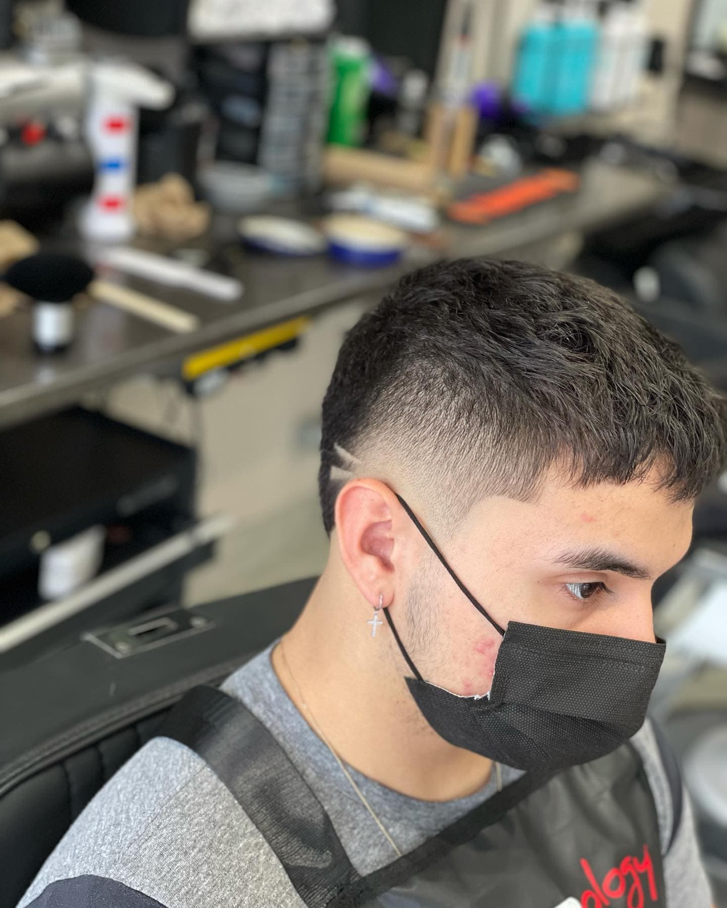 Longer textured men's hair styled at The Barber Lounge