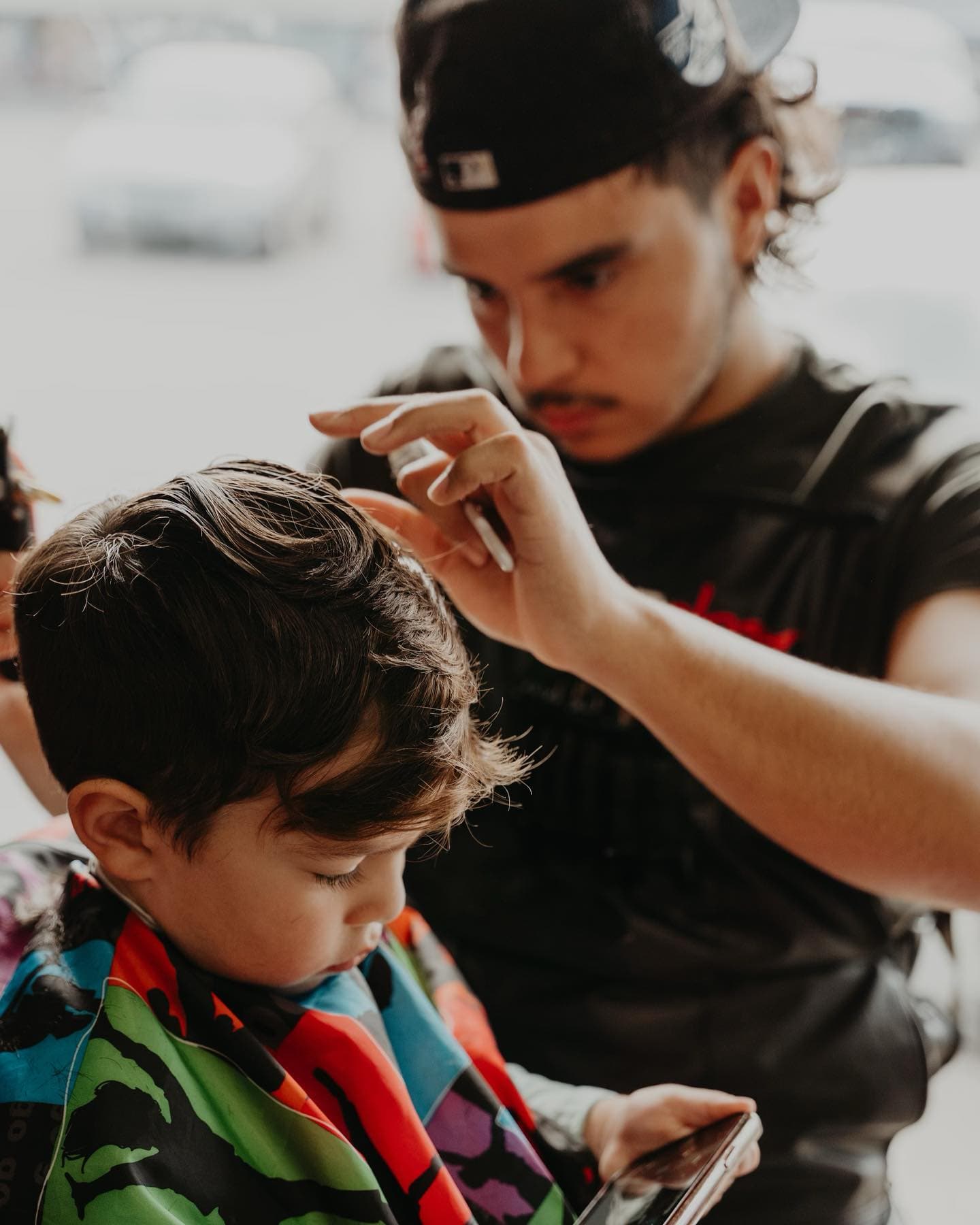 Jesse cutting a client's hair