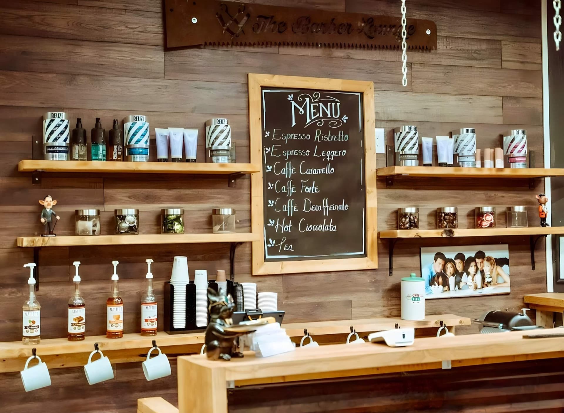 Product shelves and warm wood interior at The Barber Lounge